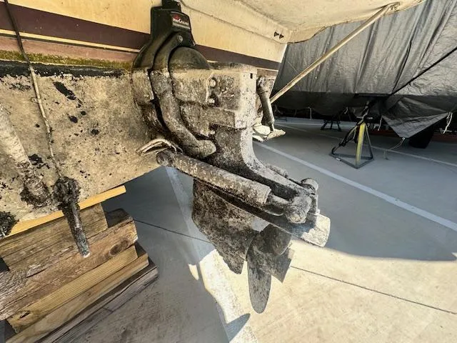 Slide: The Image of 1988 Carver 2767 Santego boat propeller and stern drive in dry dock. - 6