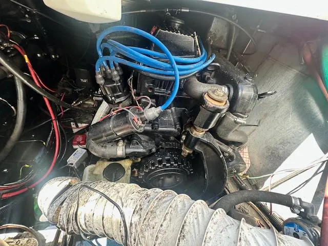Slide: The Image of Engine compartment of a 1988 Carver 2767 Santego boat with visible wiring and components. - 26
