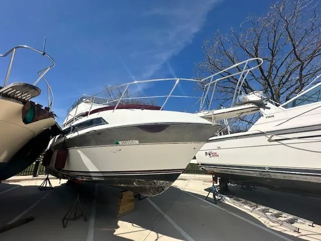 Slide: The Image of 1988 Carver 2767 Santego boat on dry dock under clear blue sky. - 3