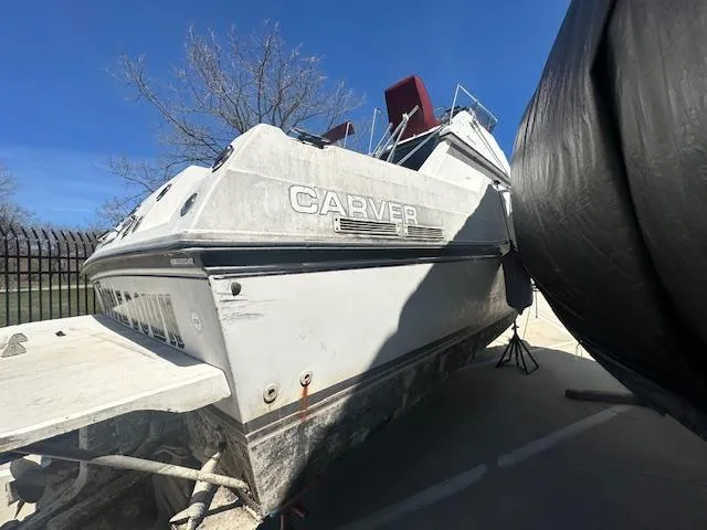 Slide: The Image of 1988 Carver 2767 Santego boat on dry dock, side view under clear blue sky. - 9