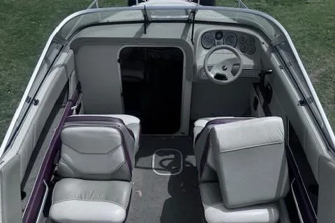 Slide: The Image of 1994 Maxum 2000 SC boat interior with steering wheel and seating arrangement. - 4