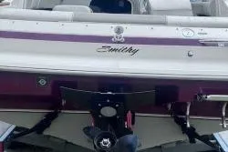 Slide: The Image of 1994 Maxum 2000 SC boat, rear view with purple accents and name "Emily" displayed. - 5