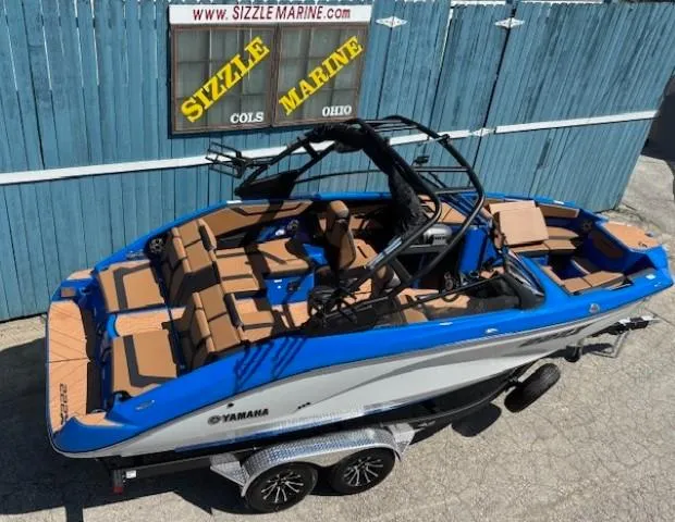 Slide: The Image of 2025 Yamaha Boats 222XD in blue and tan, displayed at Sizzle Marine, Ohio. - 4