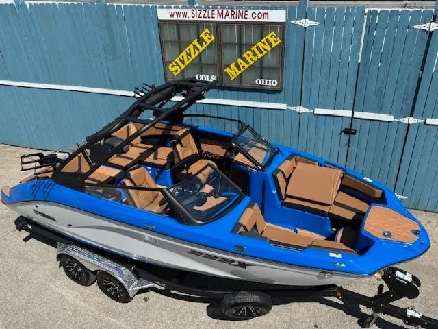 Slide: The Image of 2025 Yamaha Boats 222XD in blue and tan, displayed at Sizzle Marine, Ohio. - 5