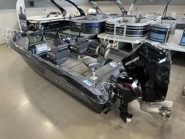 Slide: The Image of 2024 Lund 219 Pro-V GL Sport boat with Mercury engine in showroom. - 7