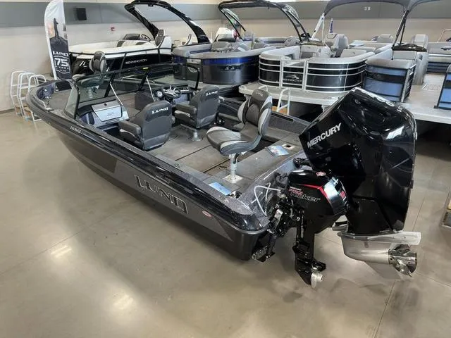 Slide: The Image of 2024 Lund 219 Pro-V GL Sport boat with Mercury engine in showroom. - 9