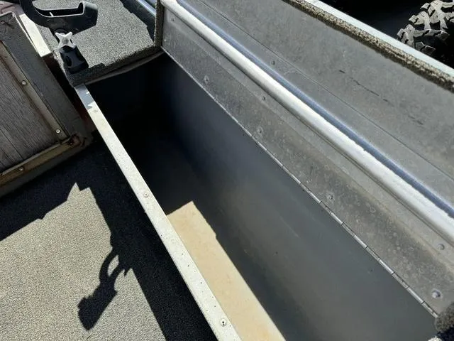 Slide: The Image of Interior view of a 1992 Tracker Super 17 Pro boat storage compartment. - 13