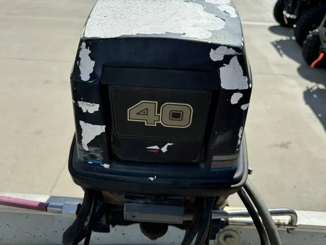 Slide: The Image of 1992 Tracker Super 17 Pro outboard motor with peeling paint and "40" label. - 15