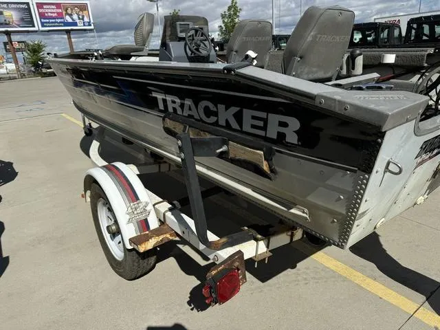 Slide: The Image of 1992 Tracker Super 17 Pro boat on trailer in parking lot. - 17