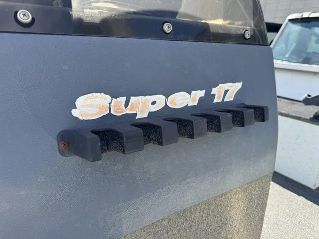 Slide: The Image of 1992 Tracker Super 17 Pro boat detail with logo and textured surface. - 19