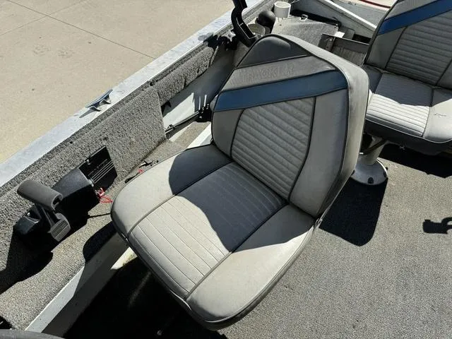 Slide: The Image of 1992 Tracker Super 17 Pro boat seat, gray upholstery, outdoor setting. - 8