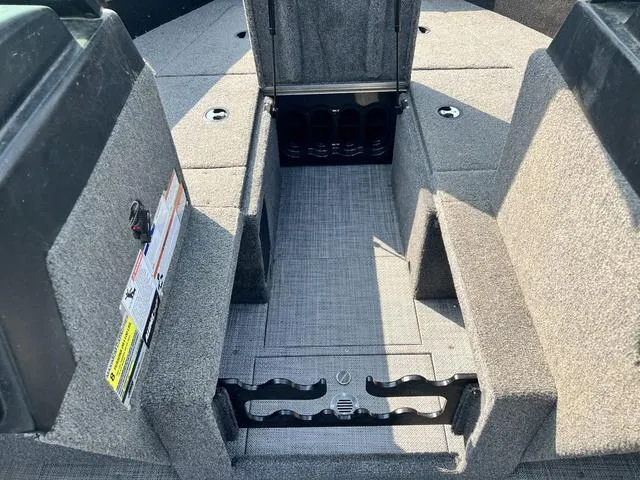 Slide: The Image of 2020 Alumacraft Trophy 185 boat interior with open storage compartment. - 10