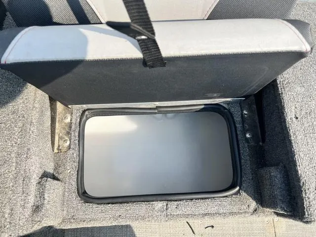 Slide: The Image of Open storage compartment in 2020 Alumacraft Trophy 185 boat seat. - 12