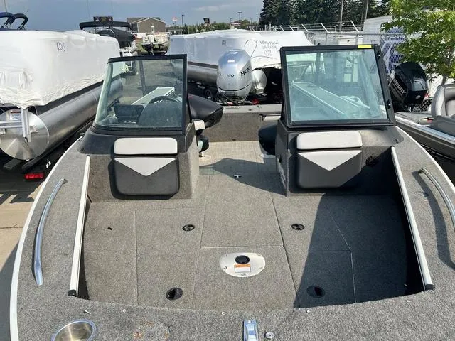 Slide: The Image of 2020 Alumacraft Trophy 185 boat interior with dual consoles and spacious deck. - 4