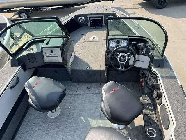 Slide: The Image of 2020 Alumacraft Trophy 185 boat interior with steering wheel, seats, and dashboard controls. - 7