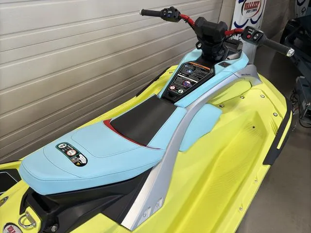 Slide: The Image of 2025 Yamaha Waverunner Jetblaster in vibrant yellow and blue, parked indoors. - 12