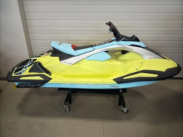 Slide: The Image of 2025 Yamaha Waverunner Jetblaster in vibrant yellow and blue, displayed indoors. - 3