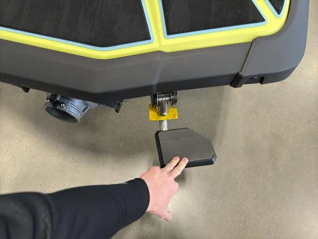 Slide: The Image of Hand adjusting footrest on 2025 Yamaha Waverunner Jetblaster, showcasing design details. - 11