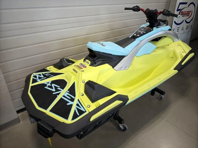 Slide: The Image of 2025 Yamaha Waverunner Jetblaster in yellow and blue, displayed indoors on a stand. - 4
