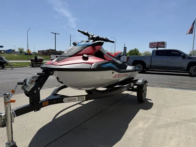 Slide: The Image of 2025 Yamaha Waverunner Jetblaster on trailer, parked outdoors under clear sky. - 4