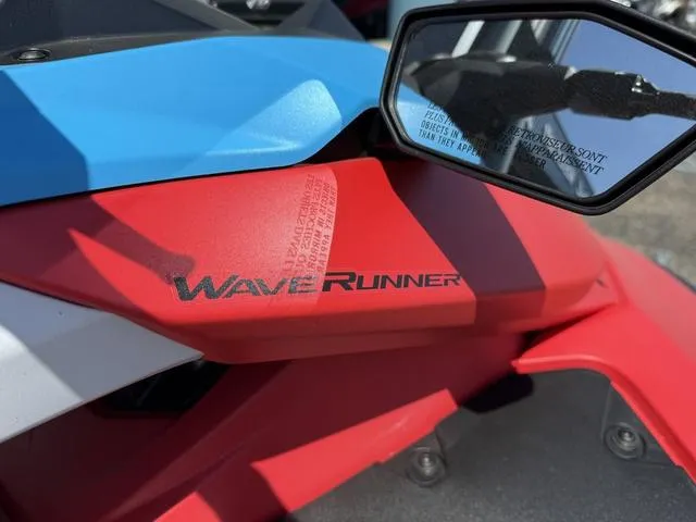 Slide: The Image of 2025 Yamaha Waverunner Jetblaster, red and blue design, with side mirror detail. - 7
