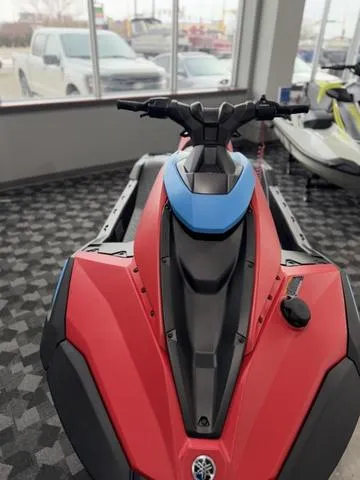 Slide: The Image of 2025 Yamaha Waverunners Jetblaster in showroom, red and black design, front view. - 3