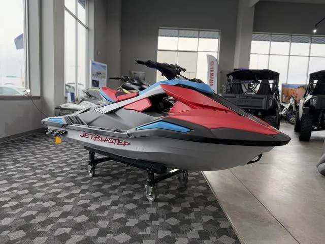 Slide: The Image of 2025 Yamaha Waverunner Jetblaster in showroom, red and blue design, on display stand. - 4