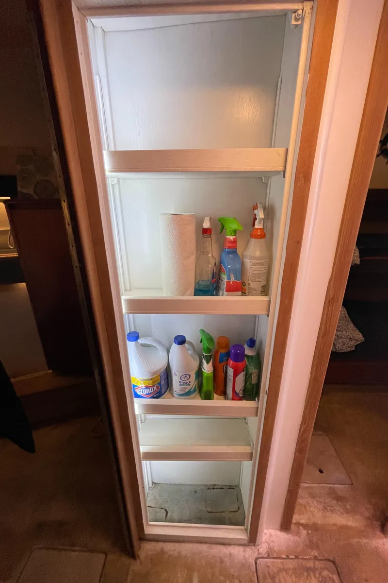 Slide: The Image of Storage cabinet with cleaning supplies on a 1990 Tiara Yachts 4300 Convertible. - 38