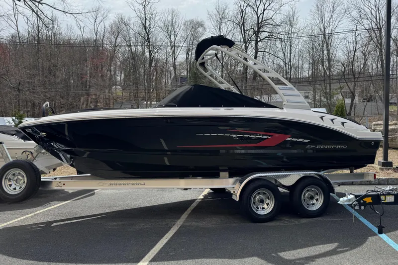 The Image of 2025 Chaparral 21 SSi IO boat on trailer, parked outdoors. - 0
