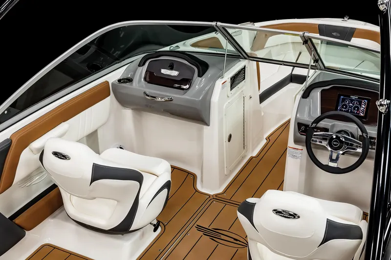 Slide: The Image of 2025 Chaparral 21 SSi IO boat interior with modern dashboard and seating. - 17