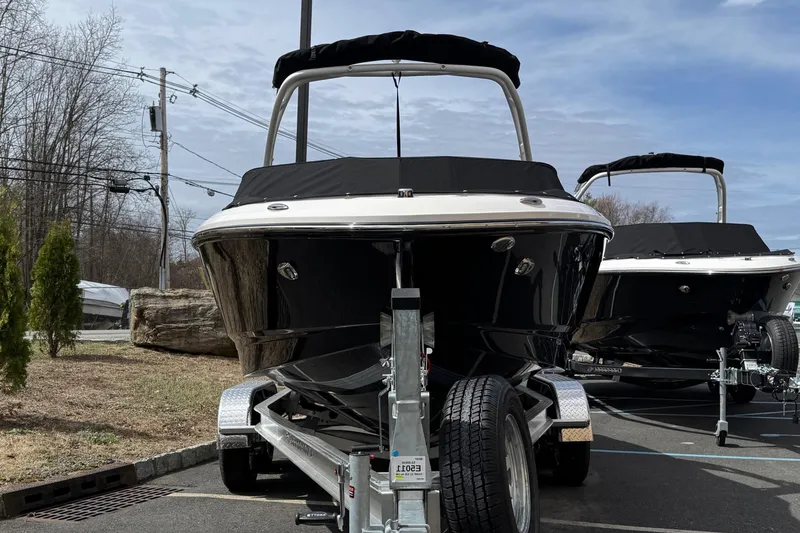 Slide: The Image of 2025 Chaparral 21 SSi IO boat, top view, featuring sleek design and spacious seating. - 5