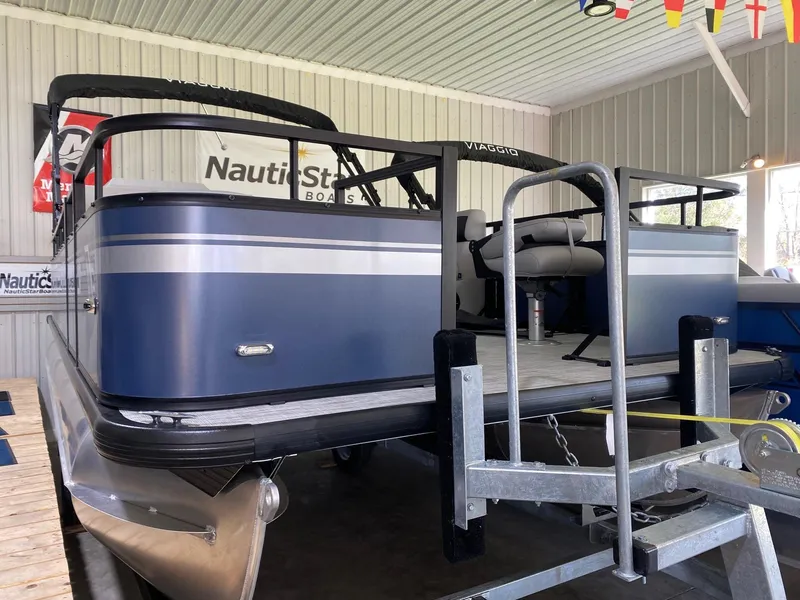 Slide: The Image of 2022 Viaggio Del Mar 18 Fish pontoon boat on trailer in showroom. - 1