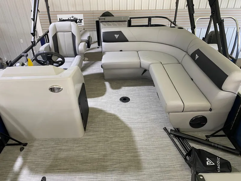 Slide: The Image of 2022 Viaggio Del Mar 18 Fish boat interior with gray seating and steering console. - 8