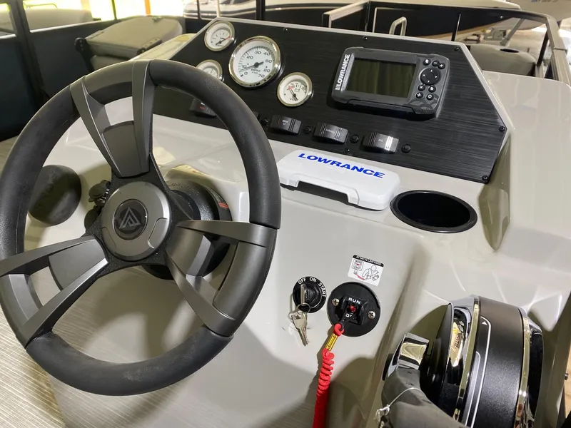 Slide: The Image of 2022 Viaggio Del Mar 18 Fish dashboard with steering wheel, gauges, and Lowrance electronics. - 9