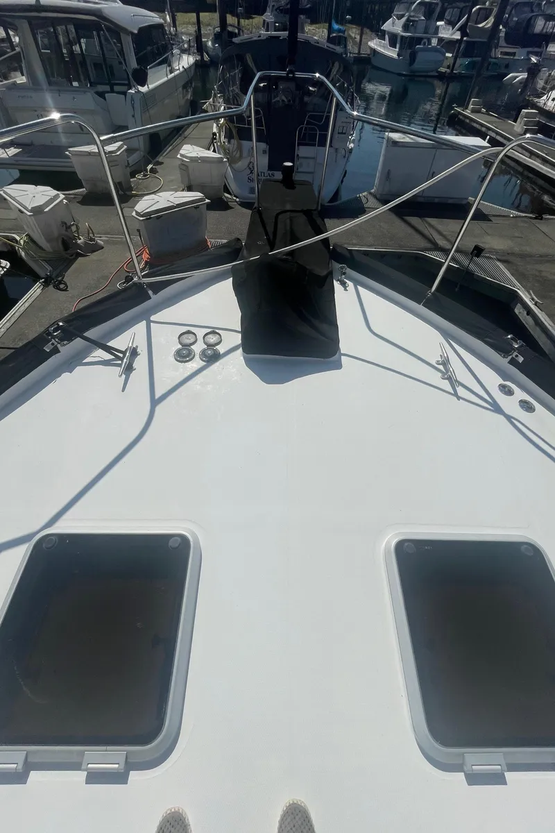 Slide: The Image of 1992 Bayliner 4588 Pilothouse yacht deck view at marina. - 2