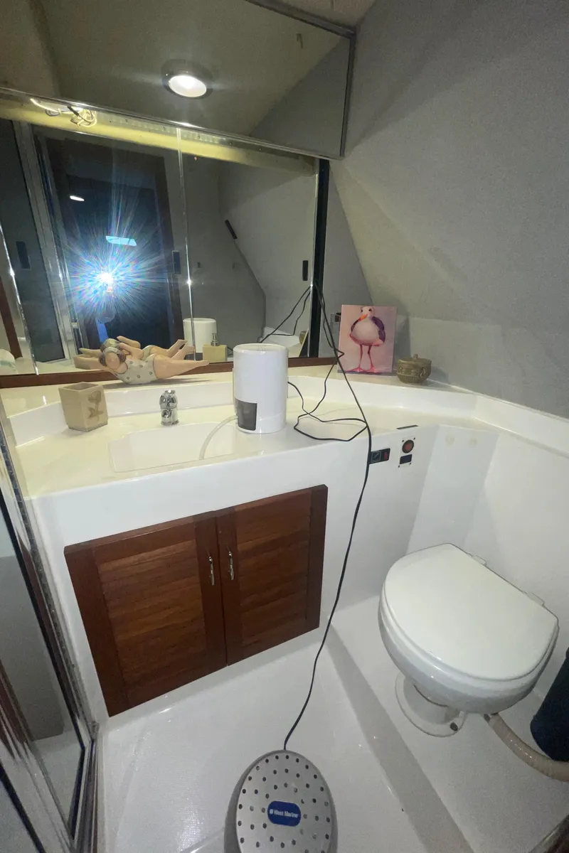 Slide: The Image of Bathroom interior of 1992 Bayliner 4588 Pilothouse yacht with modern fixtures. - 28