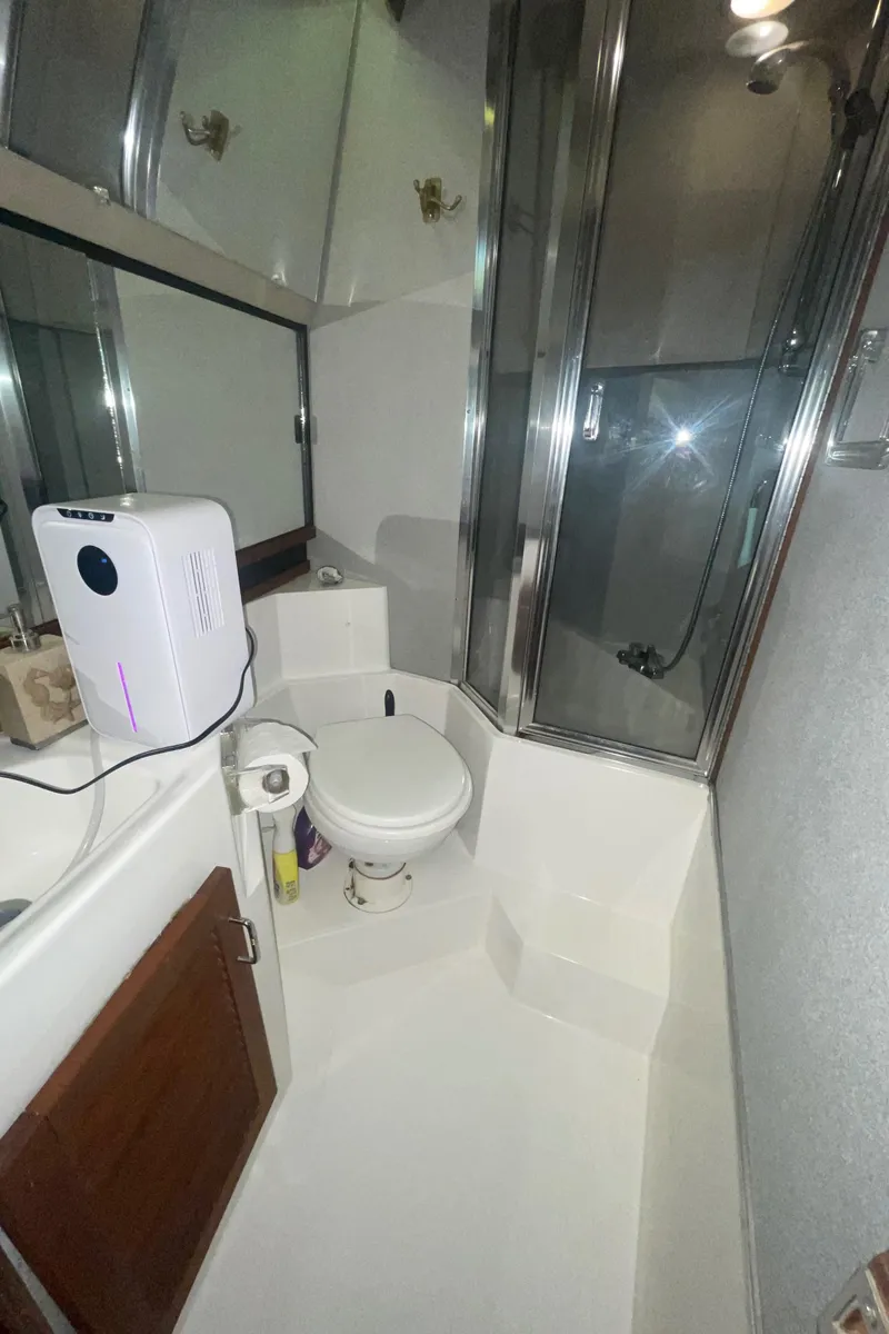 Slide: The Image of Bathroom interior of 1992 Bayliner 4588 Pilothouse yacht with shower and toilet. - 32