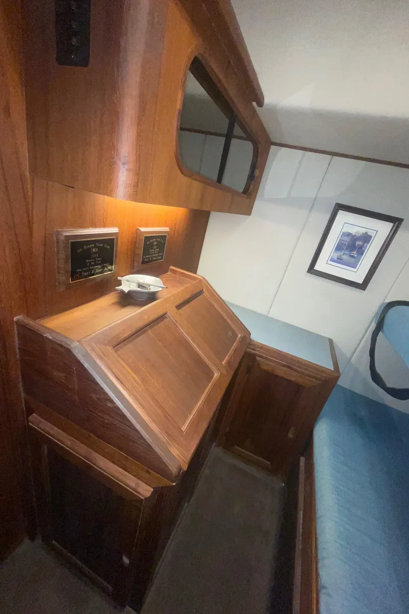Slide: The Image of 1992 Bayliner 4588 Pilothouse interior with wood paneling and nautical decor. - 37