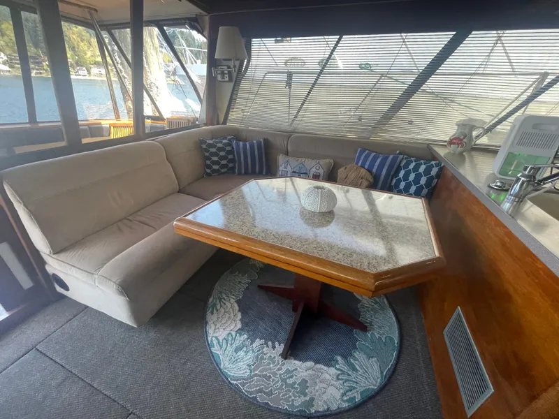 Slide: The Image of Interior of 1992 Bayliner 4588 Pilothouse with cozy seating and dining area. - 9