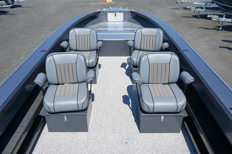 Slide: The Image of 2025 Alumaweld Columbia 23 boat interior with four gray seats on a textured deck. - 14