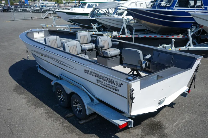 Slide: The Image of 2025 Alumaweld Columbia 23 boat on trailer, featuring spacious seating and sleek design. - 2