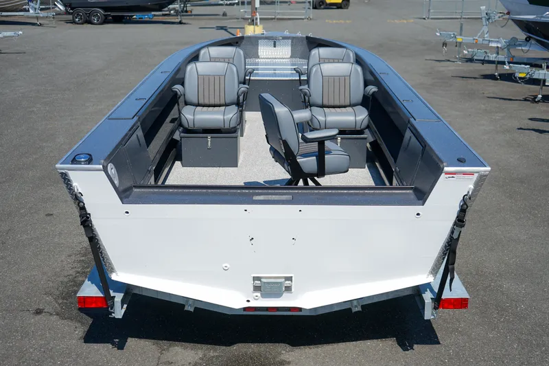 Slide: The Image of 2025 Alumaweld Columbia 23 boat, interior view with seating, on a trailer in a parking lot. - 3