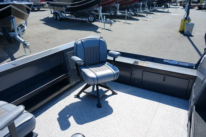 Slide: The Image of 2025 Alumaweld Columbia 23 boat interior with swivel seat, showcasing spacious deck design. - 5