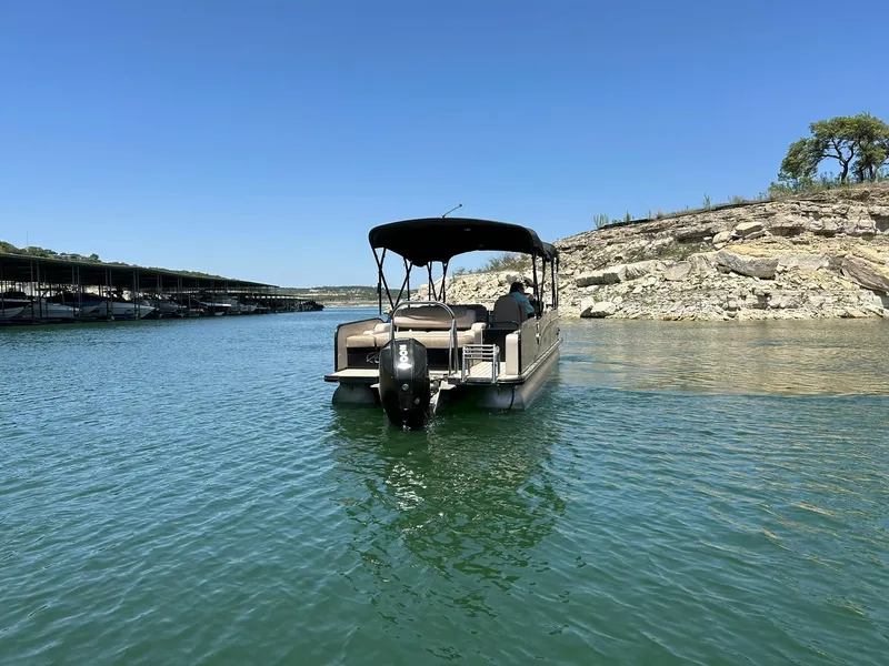 Slide: The Image of 2020 Avalon Catalina 2585 VRB pontoon boat on a serene lake. - 15