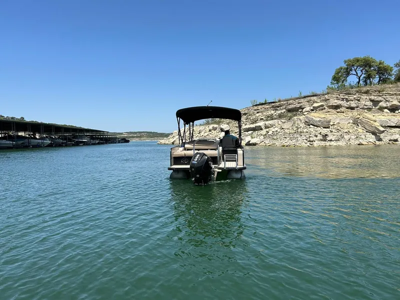 Slide: The Image of 2020 Avalon Catalina 2585 VRB pontoon boat cruising on a serene lake. - 16