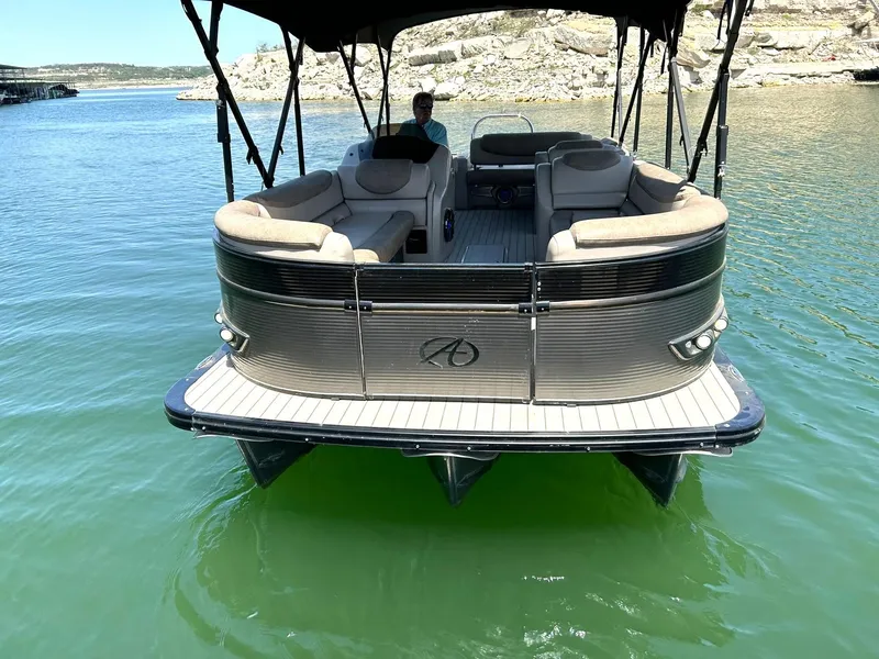 Slide: The Image of 2020 Avalon Catalina 2585 VRB pontoon boat on calm water, featuring spacious seating. - 20