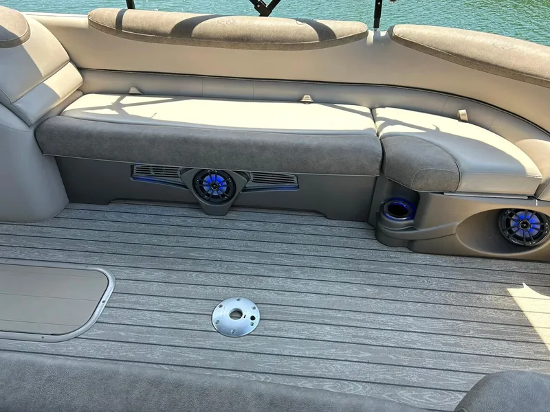 Slide: The Image of 2020 Avalon Catalina 2585 VRB boat interior with cushioned seating and built-in speakers. - 25