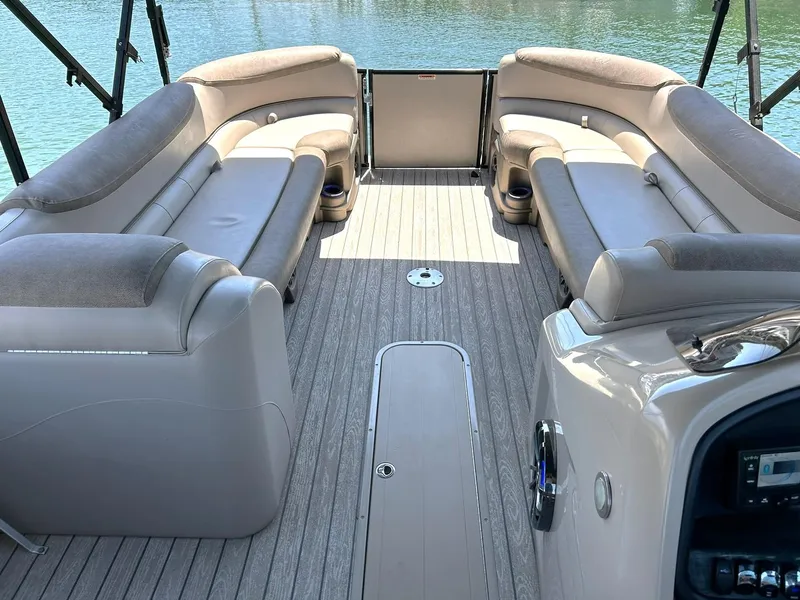 Slide: The Image of Luxurious seating on 2020 Avalon Catalina 2585 VRB pontoon boat, overlooking serene water. - 3