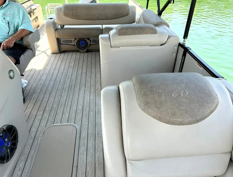 Slide: The Image of 2020 Avalon Catalina 2585 VRB boat interior with beige seating and wood-style flooring. - 30