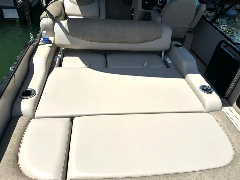 Slide: The Image of Luxurious seating on 2020 Avalon Catalina 2585 VRB boat, featuring beige upholstery and cup holders. - 33